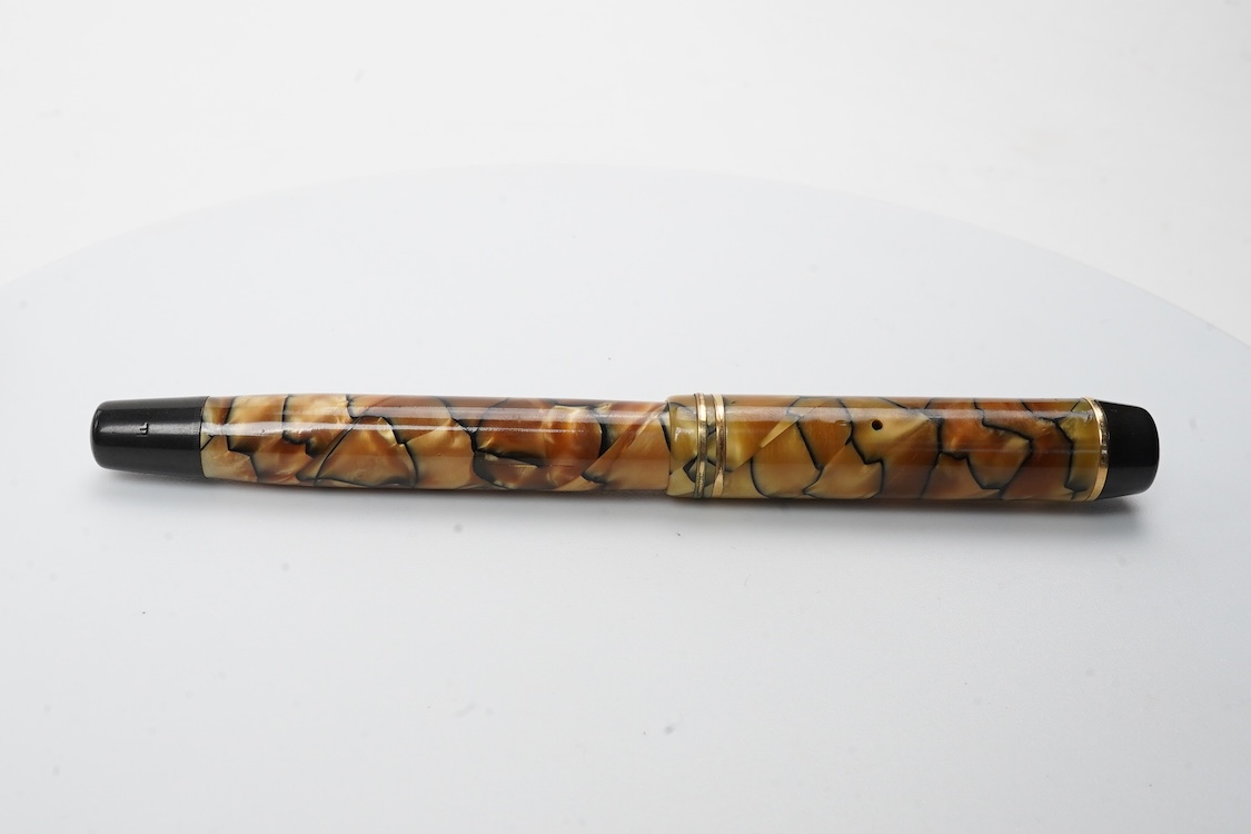 A Montblanc black and pearl fountain pen marked No.322 button filler